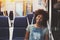 Curly afro girl in coach of suburban train