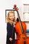 Curly beautiful girl with fiddlestick, violoncello