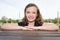 curly brunette cheerful girl child outdoors portrait