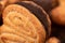 Curly cookies covered with chocolate icing, background image, close-up, selective focus