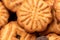 Curly cookies covered with chocolate icing, background image, close-up, selective focus