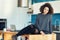 Curly girl in modern kitchen embodies cool lifestyle