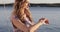 Curly girl rests on a modern yacht in the summer.