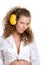 Curly girl in yellow headphones
