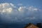 Curly thick clouds and clouds in the blue sky in the evening in late spring.