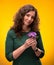 Curly woman with crocus flowers