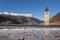 The Curon Bell tower appearing from frozen lake, Resia, South Ty