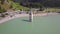 Curon, Italy. Drone aerial view of the old bell tower of the village rising out of the waters lake of Resia