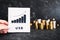 Currency exchange rate, graph showing positive growth with USD US Dollar text in front of stacks of coins