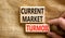 Current market turmoil symbol. Concept words Current market turmoil on wooden blocks on a beautiful canvas table canvas background