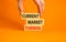 Current market turmoil symbol. Concept words Current market turmoil on wooden blocks on a beautiful orange table orange background