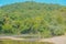 The Current River flows through the Mountains of Ozark National Scenic Riverway of Round Spring, Shannon County, Missouri