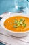 Curried carrot soup with cream and herbs