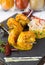 Curried King Prawns on metal skewers, served on a slate plate, with dry chilli and yoghurt.