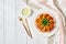 Curried pumpkin cakes on a white plate, copy space