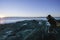 Currumbin, Australia - June 22, 2007: A photographer taking shot of sunrise over the sea