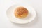 Curry bread round pan close-up on plate   on white background