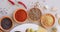 Curry, herbs and spices on table in kitchen for cooking, food or seasoning collection with color. Top View, powder and