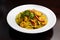 Curry pasta with vegetables and shrimps