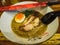 Curry Ramen with boiled egg and roasted chicken