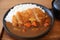 Curry rice with fried pork tonkatsu Japanese food on wooden table