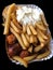 Currywurst & Pommes on black background: Famous German Fast Food Curry Sausage with French Fries and Curry Sauce