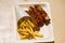 Currywurst and pommes on recyclable dishes