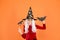 Curse spell. Little girl cast magic spell orange background. Wicked witch spell. Magic and witchcraft with spell and