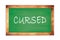 CURSED text written on green school board