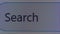 Cursor blinks in empty search bar of internet browser on computer, macro. Waiting for a text query in form. pixels of