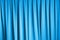 Curtain of cinema stage background, blue dramatic tone