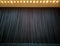 Curtain in the theatre. Theatrical background. Closed stage. Dark curtain