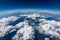 Curvature of planet earth. Aerial shot. Blue sky and clouds