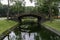 Curve bridge in the park cross small pond