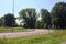 Curve in a country road bordered by trees in the italian countryside in summer