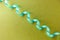 Curve green ribbon on gold paper background