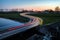 Curve light trails on country road in the landscape of the province of Groningen, The Netherlands