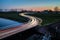 Curve light trails on country road in the landscape of the province of Groningen, The Netherlands