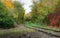 Curve rails. Hopeless post apocalyptic landscape. Cemetery of abandoned broken trains