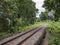 Curve railway line with the traffic signal pole.