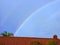 Curve rainbow across a roof