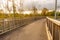 Curved bike path with wooden fencing