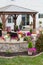 Curved brick exterior patio with wooden gazebo