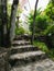 Curved cobblestone steps leading up to a house