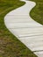 Curved concrete walk and grass