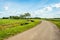 Curved country road in a Dutch polder landscape