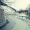 Curved country road in winter Alps