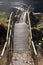 Curved foot bridge over rocks