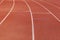 curved lane in running track or athlete track in stadium. Running track is a rubberized artificial running surface for track and f