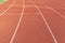 Curved lane in running track or athlete track in stadium. Running track is a rubberized artificial running surface for track and f
